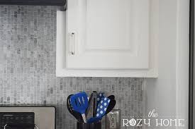 All the other cabinets have cfls lights in this area except for this one. Easy And Inexpensive Cabinet Updates The 15 Minute Fix Adding Trim To The Bottom Of Cabinets The Rozy Home