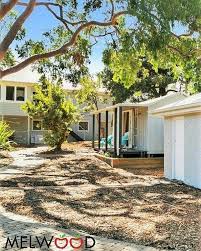 All White With A Touch Of Woodland Grey We Love It Middle Building Is The Melwood Verandah Cabana No 20 With Doubl Garden Room Backyard Cabana Garden Studio