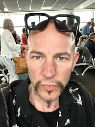 Do I look tired? Woke up before 7 AM two days in a row, early for me!  Flying to Cortland Ohio today to play a show