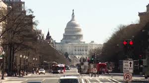 The flag of washington, d.c., consists of three red stars above two red bars on a white background. Washington D C Statehood Bill Advances To Full Vote Despite Gop Opposition Democracy Now