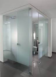Its sturdy brackets keep these floating glass shelves firmly in place, and the unique design makes them look as though they are floating on the wall. Apartment Interior By Lanciano Design Bathroom Glass Wall Glass Bathroom Bathroom Interior