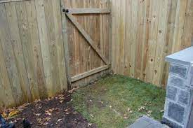 A wooden gate can finish off a fence nicely, as well as giving you a bit of added privacy around the lightly hammer the joins together to ensure it sits flush. How To Install A Fence How Tos Diy