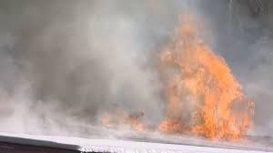 Crews are working to put out a...