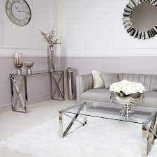 Typically situated near the front door, console tables with drawers can be used to store keys, bags or accessories in a manageable and stylish way. Zenn Contemporary Stainless Steel Clear Glass Console Hall Table Picture Perfect Home