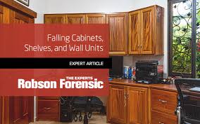 To pull off the look, make sure to maintain an equal balance between the two hues, with black cladding the lower cabinetry and island (for example) and bright whites reserved for the kitchen's upper half. Falling Cabinets Shelves And Wall Units Expert Article Robson Forensic