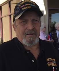 Can someone change the background of this picture to a patriotic one for my  husband's memorial?