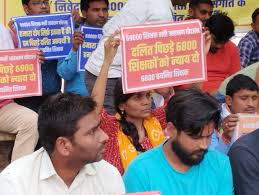 Protesting candidates demand justice after flouting of reservation rules in  UP teacher recruitment