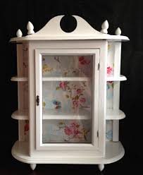 Glass door protects them from dust. Redesign Of Antique Wall Cabinet Used White Paint And Pip Wall Paper To Create A New Design Antique Wall Cabinet Wall Curio Cabinet Jewelry Box Makeover