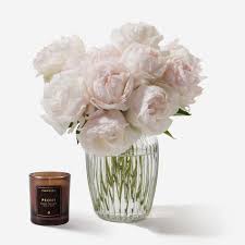 Begins pale pink, and then turns creamy white as the flower opens fully. Powder Pink Peony Flowers Flowerbx
