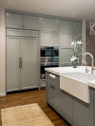 Gray And White Kitchen Features A Gray Rug Placed In Front Of A Gray Center Island C Grey Kitchen Cabinets Kitchen Cabinet Design Contemporary Kitchen Cabinets