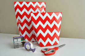 Another way to go about this process is laying the paper flat and using it to wrap your gift. How To Make A Gift Bag From Wrapping Paper In 5 Simple Steps