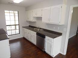 This color is a warm gray and has just a hint of beige in it.*love* Wall Sherwin Williams Crushed Ice Sw 7647 Cabinets Trim Sherwin Williams Greek Kitchen Design Small Kitchen Remodel Small Kitchen Cabinet Color Schemes