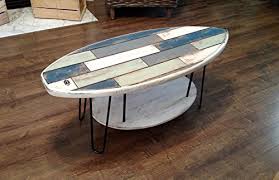 Although the polished steel rod stands are a work unto their own, the simple beauty of this table is in its completeness. 44 Faux Pallet Wood Surfboard Coffee Table Buy Online In Faroe Islands At Faroe Desertcart Com Productid 35952078