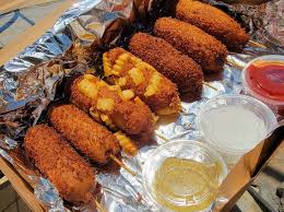American corn dogs are made with cornmeal, whereas korean corn dogs are dipped in a thick batter, then breadcrumbs and finished off with a sprinkle of sugar. Ask Amy Drew Where Can I Find Korean Hot Dogs Orlando Sentinel