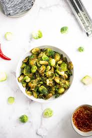 Brussels sprouts fried crisp and glazed with sweet honey, citrus flavors, and fiery sriracha. Crispy Fried Brussels Sprouts Comfort Food Ideas Appetizer Recipe
