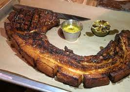 Maybe you would like to learn more about one of these? Cliff Bostock Porch Light Latin Kitchen Wields An Enormous Pork Chop