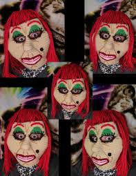 What would you name this creation and should it have a long hair coming out  of her mole, if yes, what color should the hair be?