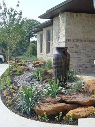 Decorative Pot And A Small Rock Garden From Xeriscape Design Westlake Texas Pos Small Front Yard Landscaping Drought Resistant Landscaping Landscape Design