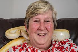 Widow overcomes lifelong phobia of snakes by adopting 9ft Burmese python