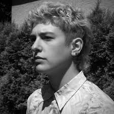 How do I feel about the man in the photos smiling wide like me