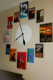 A Book Clock With Numbers In The Book Titles Book Clock Library Decor Clock