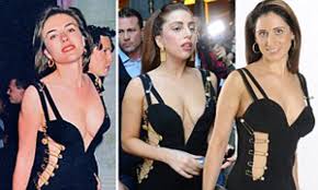 English actress and model elizabeth hurley wore a black versace dress, often referred to as that dress, when she accompanied hugh grant to the premiere of four weddings and a funeral in 1994. Elizabeth Hurley Wore Versace S Safety Pin Dress Now Lady Gaga Has Claire Coleman Wears A Bernshaw Replica Daily Mail Online