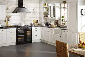 Combining Bold Graphic Black Appliances And Worktops With White Kitchen Units Brings Country Style Ki Contemporary Kitchen Diy Kitchen Fittings Kitchen Design