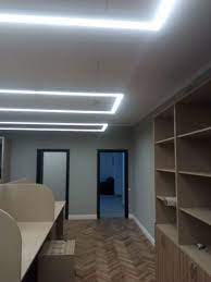 'open shelving allows you to personalise the space with objects that can be highlighted using internal lights.' The Lighting Of A Small Office Hokasu Lighting