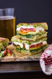 Toasted Pan Bagnat With Tomatoes Mozzarella And Arugula Recipe Food Recipes Sandwiches