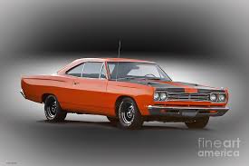In 1968, the first muscle cars were, in the opinion of many, moving away from their roots as relatively cheap, fast cars as they gained options. 1969 Plymouth Roadrunner Photograph By Dave Koontz