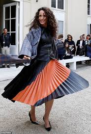 andie macdowell 60 exudes elegance in demure pleated skirt