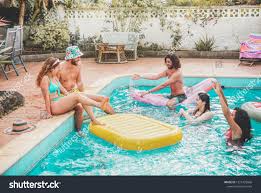 Happy Friends Floating With Air Lilo Ball At Swimming Pool Party Young People Having Fun On Summer Holida Party Swimming Pool People Having Fun Happy Friends