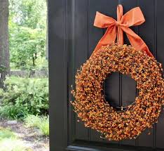 Fall orange berry acorn wreath with bow. 31 Fabulous Fall Wreaths For Your Home Simply2moms