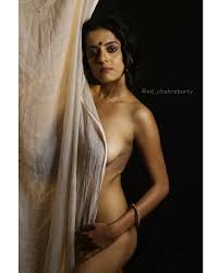 Alluring Desi MILF shows her topless big boobs and feeding her baby near  the window - CareLessNaked