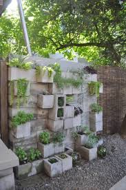 Starting at one end of the wall, lay out the cinder blocks, end to end, until you reach the first turn in the wall. 14 Cinderblock Garden Ideas For Your Veggies Flowers And Succulents