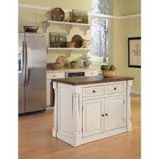 This monarch kitchen island from ensures you won't have to sacrifice style for storage. Homestyles Monarch White Kitchen Island With Seating 5020 948 The Home Depot Depot Homestyles Island Kitchen Kuchen Design Kuchendesign Moderne Kuche