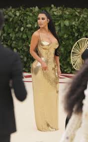 Fashion & the catholic imagination costume institute gala at the metropolitan museum of art on may 7, 2018 in new york city. Kim Kardashian Wears Shiny Gold Dress To The Met Gala Kanye Skips Met Ball