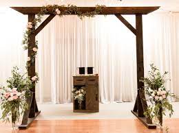 Diy a wedding arch with cherry branch and silk flowers. Diy Wooden Wedding Arbor Six Clever Sisters