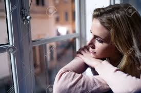 Woman looking out window night. Beautiful Blond Woman Sitting On Window Sill At Night Looking Stock Photo Picture And Royalty Free Image Image 54065283