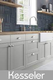 Light colored wood covers every surface except black countertops. Light Grey Shaker Kitchen With Wood Worktop Grey Shaker Kitchen Modern Shaker Kitchen Tiny House Kitchen