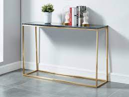 Donnez à votre salon ou couloir une touche moderne avec cette table console simple et fonctionnelle. Console Design Aretha Marbre Metal Blanc Noir