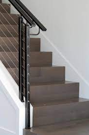 This Sleek Staircase Features Perfect 90 Degree Edges On The Beautifully Shined Wood Steps Steel Cable Ra Modern Staircase Home Stairs Design Staircase Design