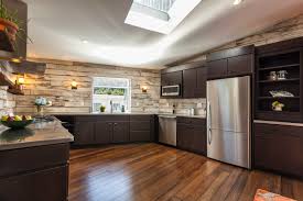 Dark earth tones on the floor allow you to choose a variety of colors for your cabinets in lighter shades. South Side Pittsburgh Remodeling Company