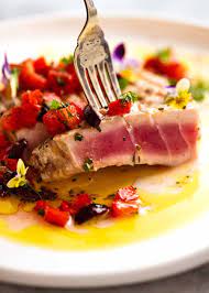 Dip a pastry brush into 4 tablespoons (56 g) of melted butter and brush it over 4 tuna steaks. Tuna Steak Recipetin Eats