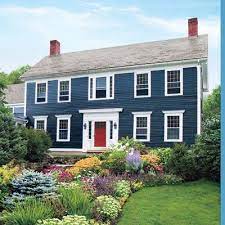 Photo house with blue shutters on windows can be used for personal and commercial purposes according to the conditions. Editors Picks Our Favorite Blue Houses House Exterior Blue Colonial House Exteriors Cottage Exterior