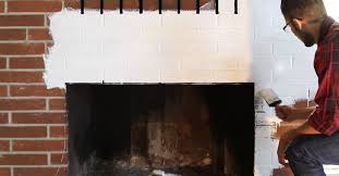 Use the stiff bristle brush to paint between the crevices of the mortar and brick. How To Paint A Brick Fireplace