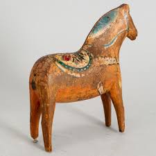 An early 20th century painted wooden horse. - Bukowskis