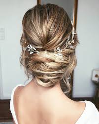 The lovely hairstyle in the photo gives a feel of extremely voluminous and a bit messy curls which fall out of the do, but the look remains neat and exquisite. Best Wedding Hairstyles For Every Bride Style 2021
