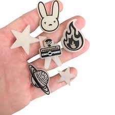 They also come with some cool jibbitz — those little charms you can put in the holes of your crocs. Best Seller Bad Bunny Shoe Charms Glow In The Dark Etsy In 2021 Croc Charms Shoe Charms Crocs