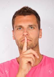 Young Man Holding Finger Over Mouth Gesturing Silence Stock Photo, Picture  and Royalty Free Image. Image 8466314.